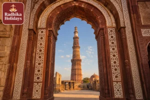 Qutub Minar tower framed through Alai Darwaza gateway arch at Mehrauli New Delhi