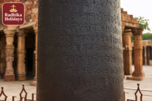 Ancient Iron Pillar inside Qutub Minar complex Mehrauli New Delhi showing Sanskrit inscriptions